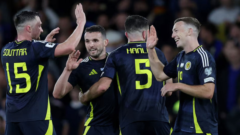Skotlandia mengambil langkah signifikan untuk mengamankan tempat play-off Piala Dunia ketika gol internasional pertama Lewis Ferguson membantu mengamankan kemenangan comeback yang tak terduga atas Yunani yang dominan di Hampden
